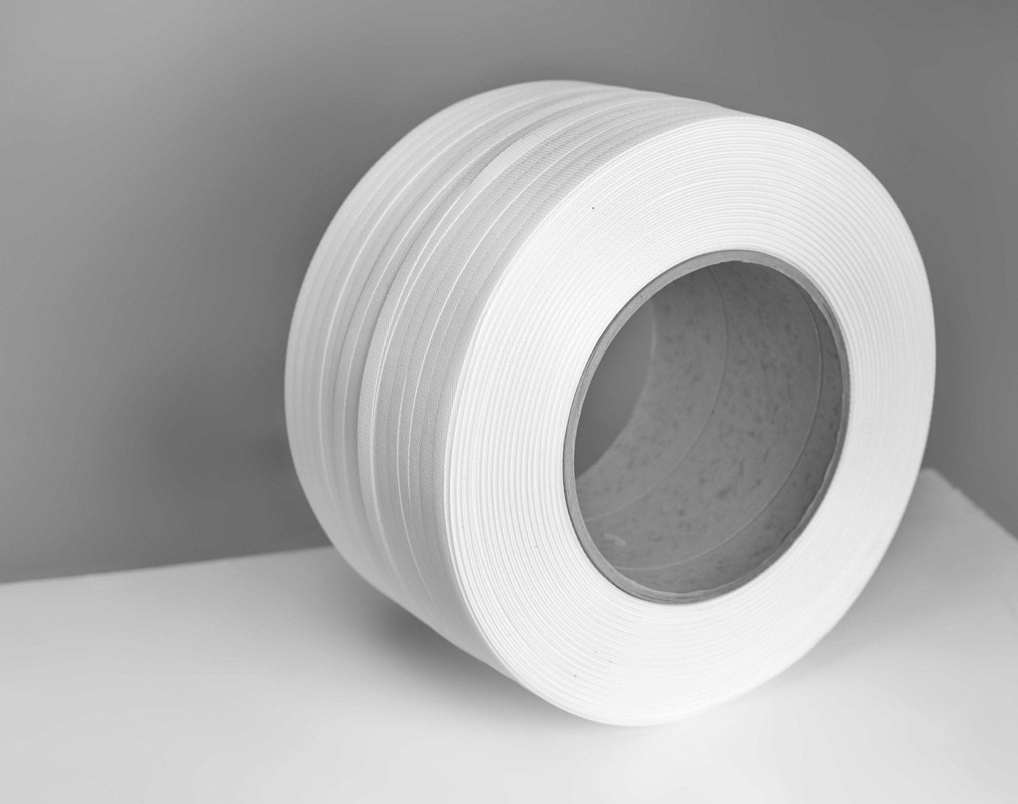 Zuncho PP Blanco 12x0.7 mm. rollo de 2.100 mts. valor incluye IVA